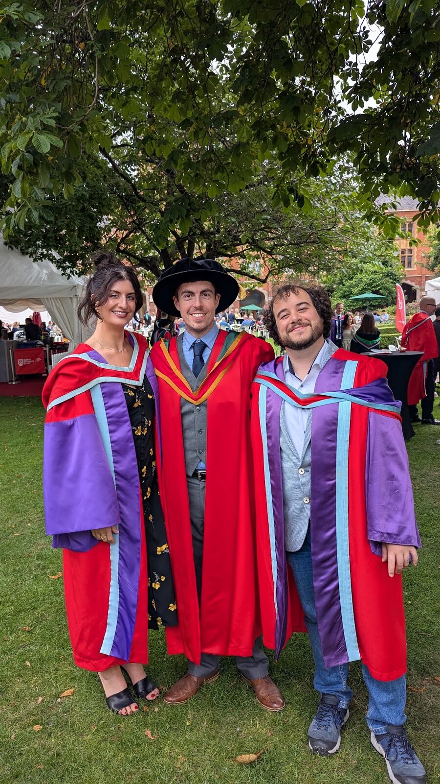 David Courtney with Dr Stefano Bonazza and Dr Hannah Coutts in their graduation robes at Queen's University Belfast