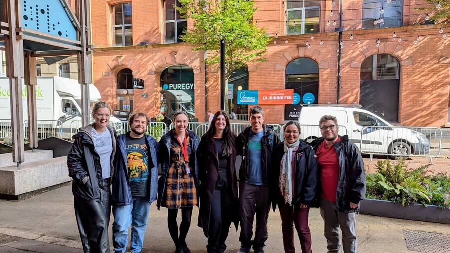 The Courtney Group together on a city street